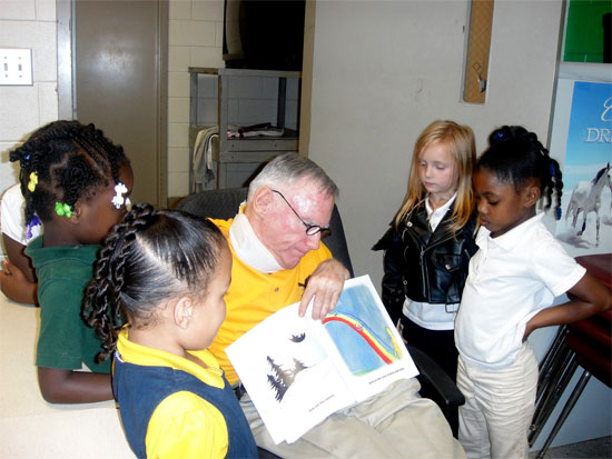 Mr. White with Children reading his book