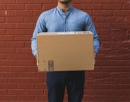Man holding box to be shipped